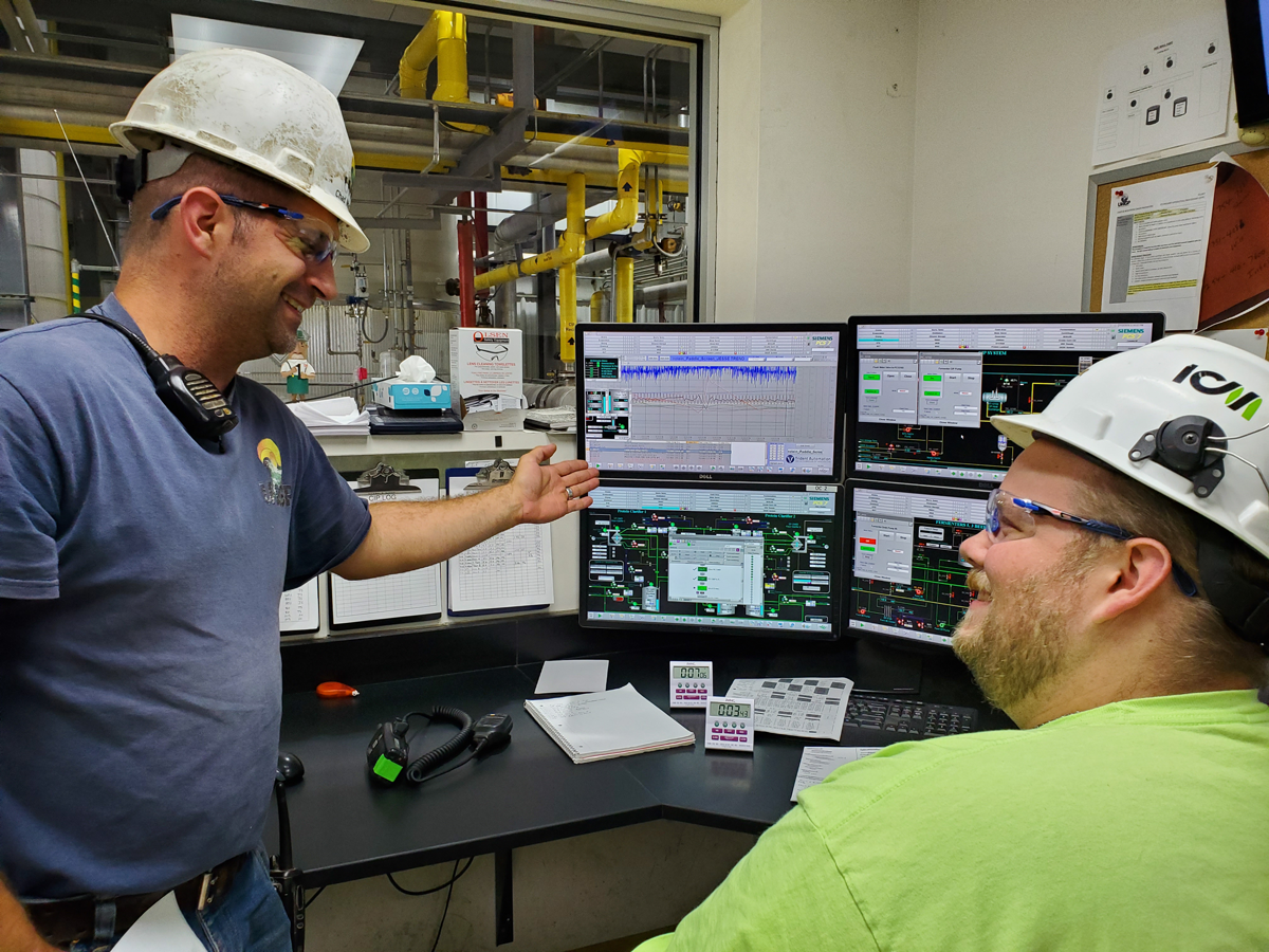 Two-men-viewing-monitors-at-UWGP